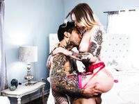 Inked Slut In Fishnet Stockings Gets Fucked Hard In Bed photos (Baby Sid)