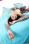 Tattooed model Evgenia Talanina teasing with her monster natural breasts