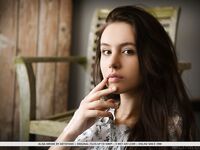 Sweet brunette teen Alisa Amore removes blue jeans on way to modeling naked