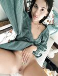 Dark-haired amateur babe Erel grabs her big tits and spreads her pussy