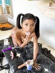 Petite ebony babe Tita Sahara plays with milk in her masturbation chamber