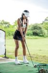 Skinny amateur Tita Sahara poses in a short golfer skirt on the golf course