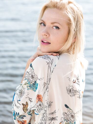 Blonde sweetie Camelia shows her fine body and poses in the sea